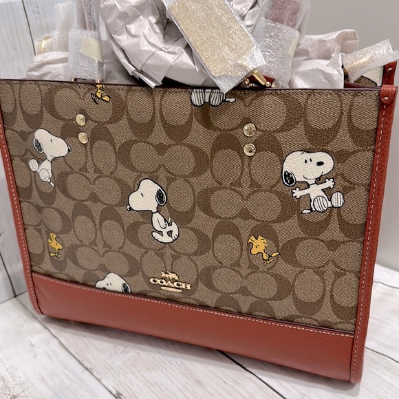 Coach Handbags - Coach X Peanuts Dempsey Carryall In Signature Canvas With Snoopy Woodstock Print